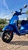 Front view of a 2020 Vespa GTS 300 HPE in Matte Blu Vivace with LED headlight and red front suspension.