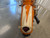 Rear view of a custom-molded hot rod style fender and bullet taillight on a pearlescent orange CSC Classic motorcycle.