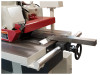 Precision rip fence with micro-adjustment by handwheel 
Quick setting rip fence runs on round cylindrical guide. Fence is notched to pass over and under the table and top kickback fingers for faster change over.