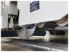 Eight hold-down rollers over six rows 
Eight hold-down rollers over six rows ensure the workpiece is held firmly to the chain track during cutting operations. Proper hold down ensures glue line accuracy.