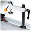Hold down clamp The saw comes equipped with an eccentric clamp which can be used for clamping the workpiece in place during cutting operations. The clamp can be quickly set in place anywhere along the t-slot in the table. In addition, the machine comes with a wedge for solid wood ripping (not shown).