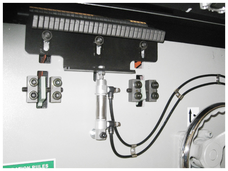 Auto Lowering Bottom Kickback Fingers 
A sensor will detect when a workpiece is on the table which will automatically lower the bottom kickback fingers to allow for additional table surface to align the workpiece before feeding into the machine.