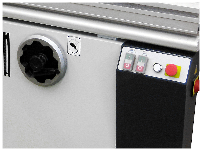 Control panel & tilt handwheel and gauge 
The main saw blade is raised and lowered by individual handwheels. A scale indicates the blade angle and is located conveniently next to the tilting handwheel. A wrench adjusts the scoring height and lateral positioning through the top of the table. The main and scoring motors are equipped with individual on/off buttons and an emergency stop button