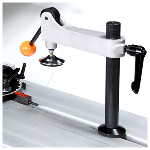 Hold down clamp The saw comes equipped with an eccentric clamp which can be used for clamping the workpiece in place during cutting operations. The clamp can be quickly set in place anywhere along the t-slot in the table. In addition, the machine comes with a wedge for solid wood ripping (not shown).