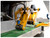 Pneumatic Top Hold Down Pressure Rollers
 The material is held down on the conveyor using two pneumatically tensioned idle rollers, one in front of the blade and one behind.