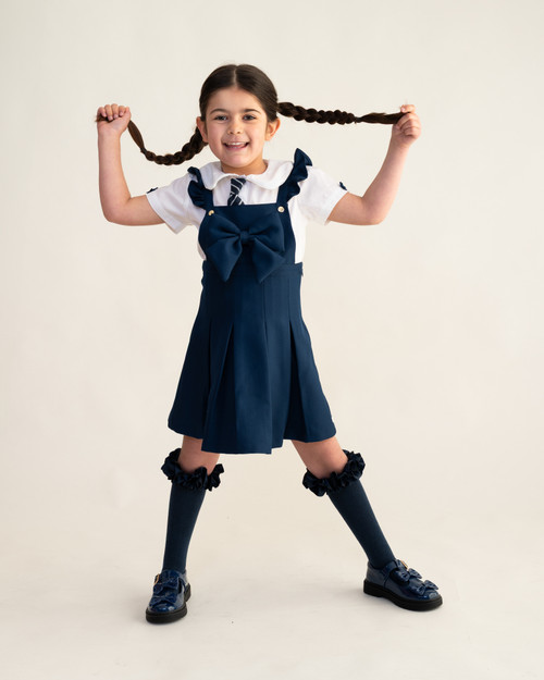 EXCLUSIVE Caramelo Girls Navy School Pleated Pinafore with Bow 342188