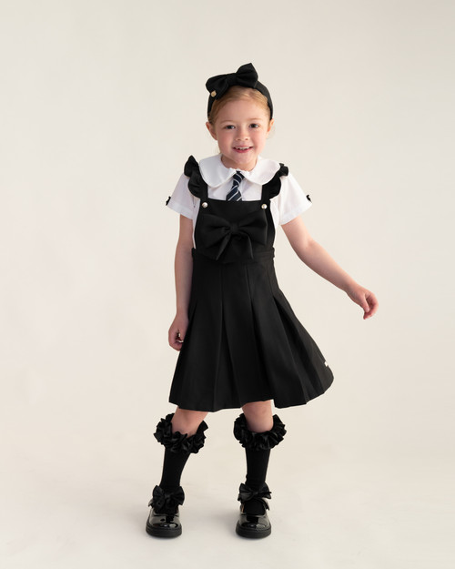 EXCLUSIVE Caramelo Girls Black School Pleated Pinafore with Bow 342188