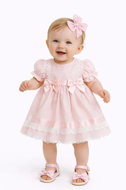 Kinder Boutique Pink Dress with pink trim and 2 pink bows