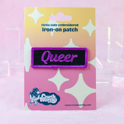 Queer patch by Crushworthy - A purple and black patch styled after mechanic name tag patches, perfect for jackets!