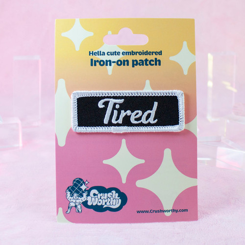 Tired patch by Crushworthy - A black and white patch styled after mechanic name tag patches, perfect for jackets!