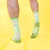 Casual socks by Crushworthy featuring cactuses shaped like penises in shades of green