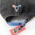 Trans Throwback Cap by Crushworthy - A fun retro embroidered design that says "Trans" with the trans symbol below it on an acid wash black baseball hat.