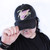 Thembo Throwback Cap by Crushworthy - Fun retro embroidery that says "Thembo" with a trans symbol below it, embroidered directly onto an acid wash black baseball cap.