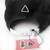 Queers Bash Back Cap by Crushworthy - Black and white embroidery that says "Queers Bash Back" with a fist on top of a triangle, embroidered directly onto an acid wash black baseball cap.