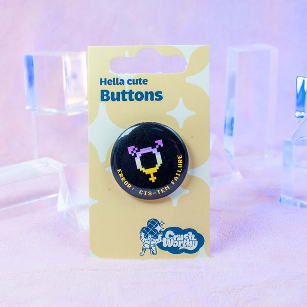 Cistem Failure button by Crushworthy - A pixel trans symbol in the nonbinary pride flag colors on a black button with a metal pinback