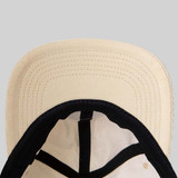 View of Heritage Pickle-ball Circle Patch Corduroy Hat under bill in the color Butter.