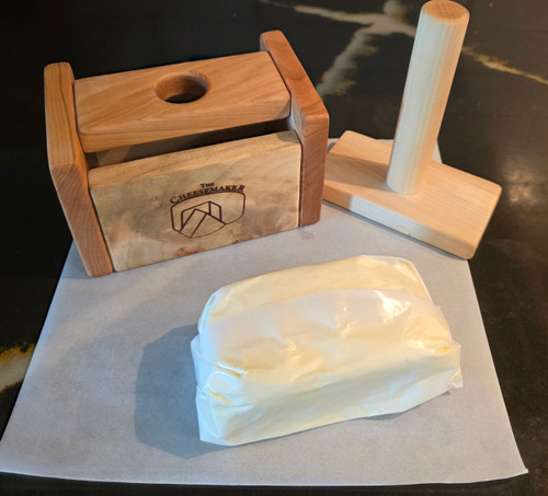 Wrapped home made butter;  try our BUTTER PRESS to both press out excess whey and shape your butter!
(Butter Press shown in image is not included with Butter Wrap)