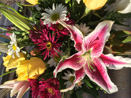 Fragrant Stargazer  lily with Roses and greens in a 5" square glass cube