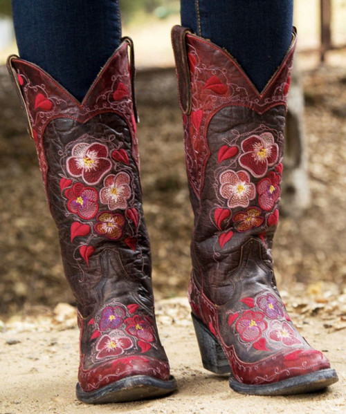 Old Gringo Pansy

Embroidered pansies defines the persona of this boot.

The distressed leather is soft and versatile.

If you are looking for a romantic pair of cowgirl boots, then this is for you!

Shaft height: 13" 

Color: Chocolate - Red

Toe: Sintino

Heel: Sintino