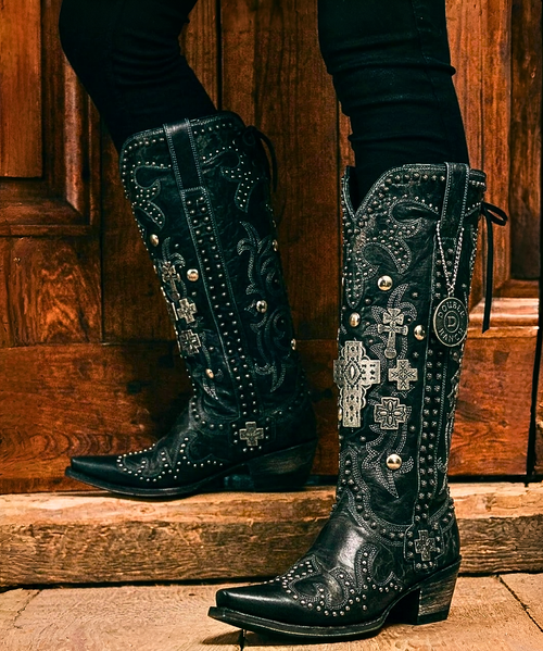 FEW BOOTS CAN MATCH THE ARTWORK OF THE DOUBLE D RANCH AMMUNITION BOOTS IN BLACK & EXPRESSO BROWN.  

 
STRONG AND ORNATE WITH A SOFT BLACK LEATHER LACE THAT CORSETS UP THE BACK OF THE BOOT THE AMMUNTION IS FOR THE COWGIRL WITH A LITTLE REBELIOUS SIDE TO THEM. THESE BOOTS WILL TURN HEADS LEFT AND RIGHT AND WITH OLD GRINGO COMFORT AND STYLING THESE BEAUTIES WILL KEEP YOU IN TOTAL COMFORT ALL DAY LONG. 
 
 

Measurements:

 

Shaft Height - 16
Shaft Opening - 14" 
Heel Height – 1 3/4” 
Toe – Snip 
Standard Width