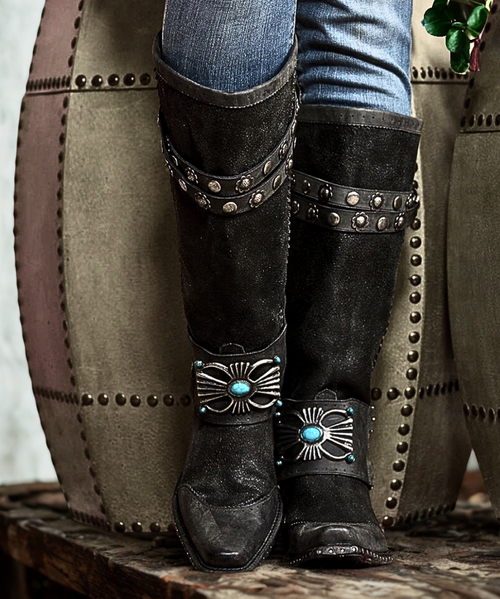 We found a pair of boots that mixes fierce western fashion with rocker chic personality, and the product is truly one of a kind.  The Bow Guard in black distressed leather, designed by Double D Ranch artists manufactured by Old Gringo Boots, and made to the highest quality standards.   The stunning black distressed leather and the gorgeous turquoise stone accents will have you falling in love at first sight.  Other features include silver hardware, studded straps near the boot collar, and a killer square toe. You'll be a fashionable, country diva in the Double D Ranch Bow Guard Boots!

Color: Black

Shaft: 15"

Toe: Square

Heel: Riding Heel