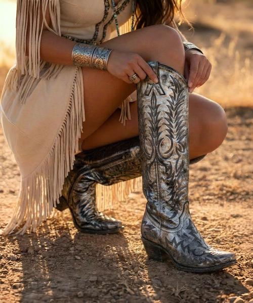 urn some heads in these beautiful Mayra Boots from Old Gringo! 
Constructed from a rich, silver metallic leather, this boot features embroidery in the classic Mayra pattern.