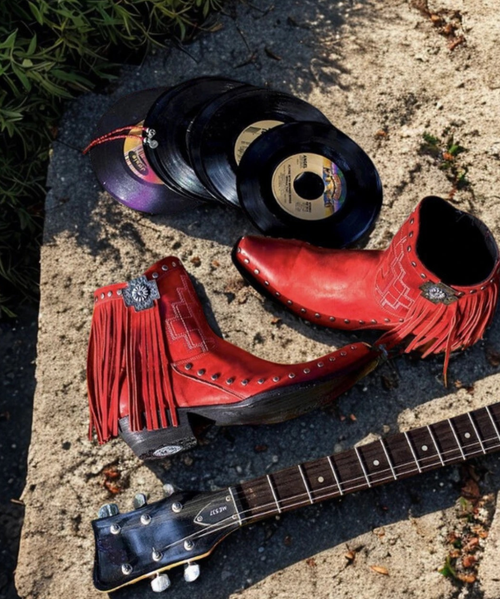This cute little half-pint boot is perfect for all ages and seasons.  We used muted, silver crosses and lots of fringe to make this boot definitive Double D Ranch.  The more you wear it and let it age naturally, the better this shortie will be.

Toe: snip
Leather: brushed nubuck leather
Heel: riding heel
Features: nail heads, stamped cross concho, knotted fringe, inside zipper, western stitching