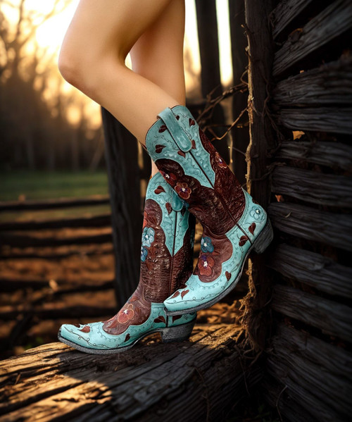 Try something new, something blue this spring. A revisited version to our Staple design - Pansy, the color contrast adds a playful touch. Embroidered floral details on the shaft and the vamp, with easy pull tabs on the side. In our regular cowboy heel and snip toes, its great for the season. Find a retailer below that has your size on order. 

 

Color: Brass/Blue

 

Toe:  4long

 

Heel :  9964

 

Shaft Height: 13"