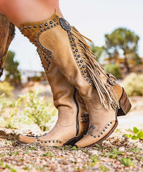 These boots make a statement so you don’t have to.

Double D Ranch’s Rusty Ravine Boot is the perfect cross-over boot – from runway to rodeo play - these kicks do the talking. Hand crafted in calfskin, and detailed with slotted conchos, nail heads and fringe – these collection boots draw their inspiration directly from the early vaqueros.  

Features:

Toe: Southern

Leather: brushed nubuck with calfskin contrast

Heel: tall fashion

Slotted conchos

Nail heads

Fringe

Buckled back strap