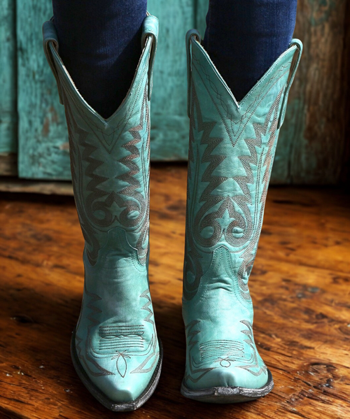 If you're looking for turquoise cowgirl boots, consider the Old Gringo Nevada Aqua. These are the perfect western accessory for adding a pop of color to your wardrobe.  The Nevada Boots have a 13" shaft, comfortable snip toe, and easy walking heel. Anyone can wear brown cowgirl boots, but it takes a fun, confident gal to rock the Nevada Aqua Old Gringo Boots!

Measurements:

Shaft Height - 13"
Shaft Opening - 14"
Heel Height - 9964  
Toe - Snip
