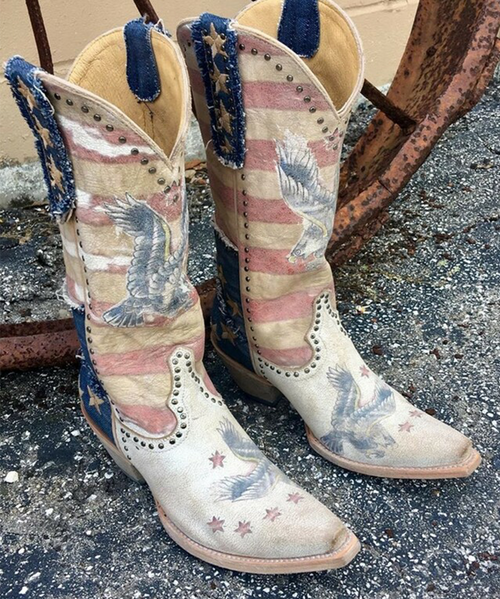 Old Gringo brings another patriotic hit to the Yippee Ki Yay Jorie boot.

The design captures freedom with flag stripes and all of the symbols we have come to love about America.

Embroidered stars, stamped Eagles, nickel studs, and denim overlay make this patriotic boot a must have for any serious Old Gringo boot collector...let this boot shout "Land of the Free and Home of the Brave".

Measurements:

Shaft Height - 13"
Heel Height - 1 3/4" 
Toe - Snip
Heel - 4Long