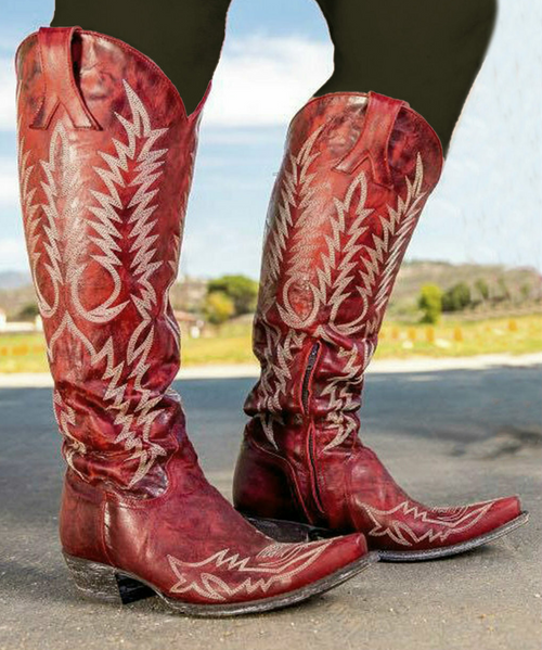 The Old Gringo Mayra Boots are SO on trend. These aren't just cowgirl boots; these are fabulous fashion boots. Handcrafted in Leon, Mexico with gorgeous distressed red leather and accented with white embroidery. We love the tall, 18" silhouette and pointed snip toe of the Mayra Boots. Relaxed Fit.