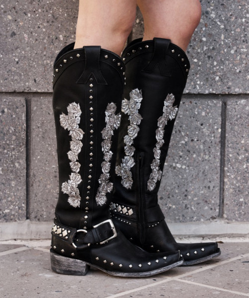 A Little Bit of Country + A Little Bit of Rock & Roll.

Embellished with crystals, studs and embroidered rose in silver, finished off with a metal ring harness with a buckle strap over the ankle.

A piece of art, that's exactly what this boot is.