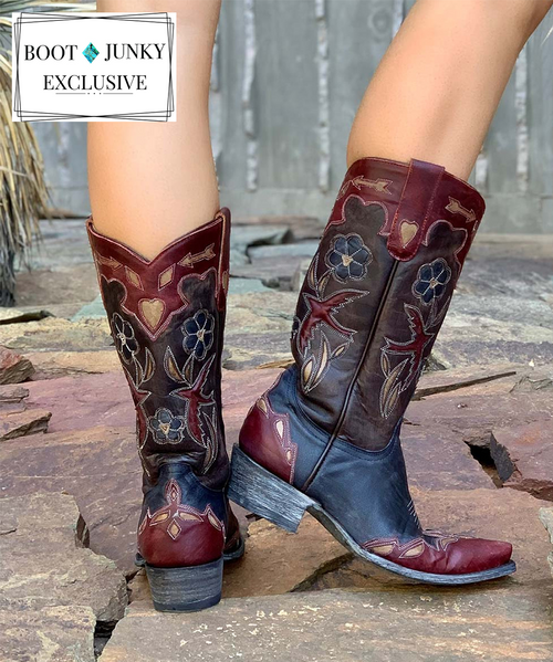 You're wearing a piece of fine art when you wear Old Gringo's Goldonrina Navy, Red, & Bone .  The leather upper features an intricate cut-out and overlay design that includes colorful leather insets and a contrast-color vamp and collar. 