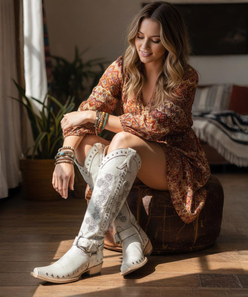 A Little Bit of Country + A Little Bit of Rock & Roll.  Embellished with crystals, studs and embroidered rose in silver, finished off with a metal ring harness with a buckle strap over the ankle. 

A piece of art, that's exactly what this boot is.

Hand placed silver studs, sparkling crystals and outstanding silver rose embroidered across the shaft, all come together against the signature Old Gringo Crackled white leather. Tall European Silhouette, Silver brush off finish on the sole; it's a boot like no other boot.  
