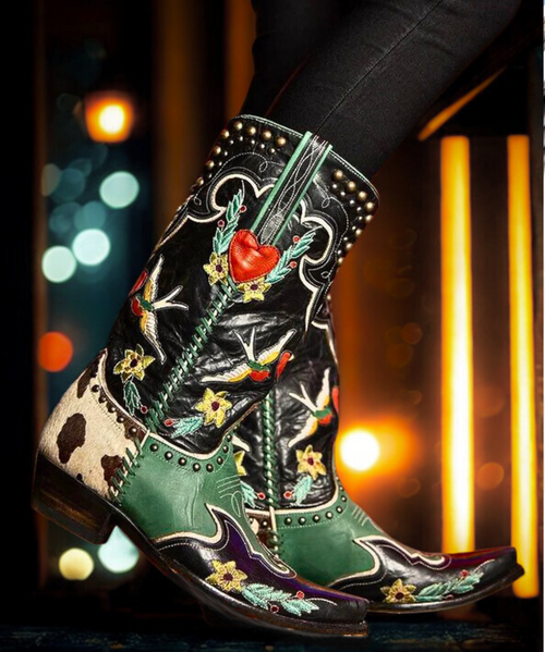 “I’m walkin’ here!” The namesake boots of the Midnight Cowboy collection have a little bit of everything that influenced us from the movie: from the signature color scheme of blacks and retro teal to the whimsical designs of hand-stitched florals and love birds, to the sneak peek of pony hide on the heel paying homage to the film’s iconic suitcase.

toe: snip
heel: riding heel/9964 (1.625")
shaft height: 13"
leather: various
features: contrast leather piecing, contrast leather overlay, contrast leather underlay, embroidery, contrast stitching, contrast leather lacing