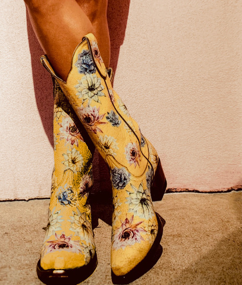 In true retro style this adorable Yippee boot is hitting it out of the park...with the soft yummy crackled leather as a base to the floral stamped flowers we simply can't sing it's praises loud enough...no collection will be complete without it!

Side pull loops for easy entry. 
Luxuriously soft leather lining.
Lightly cushioned leather footbed. 
Snip toe.
Stacked leather heel.


Measurements:

Heel  9964
Toe - 4L Snip
Circumference 12.5"
Shaft: 13"