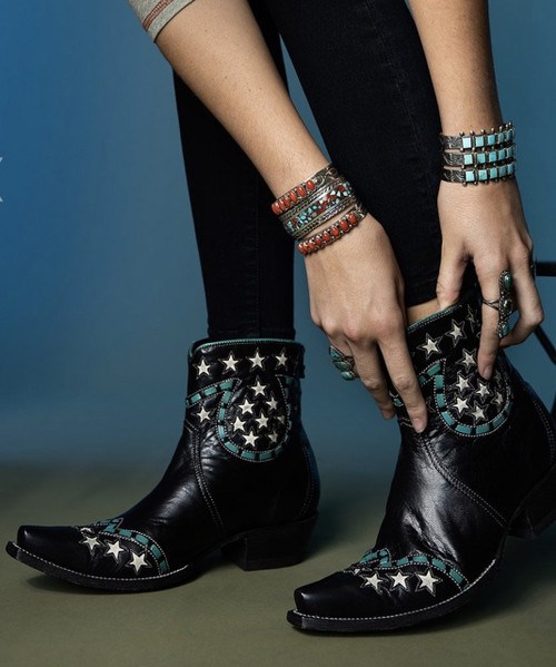Kick up some fun in these star-spangled cutie booties designed to shine wherever you go! This short, sassy silhouette is endlessly versatile—perfect with everything from skinny jeans to flirty sundresses. So good we made them three ways, these must-have booties come in warm brown, bold black, and a show-stopping red—because one pair is never enough.

Crafted from supple leather, they feature eye-catching contrast leather inlays, contrast lacing, and decorative stitching that add personality and polish. A classic snip toe and comfortable riding heel keep the look sleek and wearable, while the back zipper makes slipping them on effortless.

Fun, flirty, and full of attitude—these booties are ready to become your new everyday favorites.

Details:

Toe: Snip

Leather: Supple leather

Heel: Riding / 9964 (1.65")

Shaft height: 7"

Contrast leather inlays

Contrast leather lacing

Contrast stitching

Back zipper for easy wear