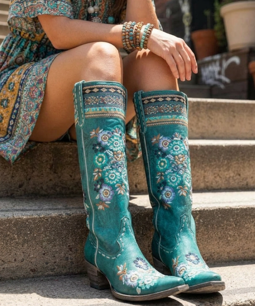 BEAUTIFUL PAIR OF CHOCOLATE LEATHER BOOTS WITH TURQUOISE OVERLAY TOOLING AND TOOLED FLOWERS. THE TWO DIFFERENT COLORED LEATHERS ARE PERFECTLY CRAFTED BY OLD GRINGOS DESIGNERS. THE HAND TOOLING WORK MAKES THESE BOOTS STAND OUT! THESE BOOTS PAIR WONDERFULLY WITH YOUR FAVORITE PAIR OF SKINNY JEANS! BECAUSE OF THE INTRICATE TOOLING DESIGN, THESE BOOTS CAN BE WORN CASUALLY OR ALL DOLLED UP! 

Measurements:

Shaft Height - 18"
Heel - 4 Long
Toe - Snip