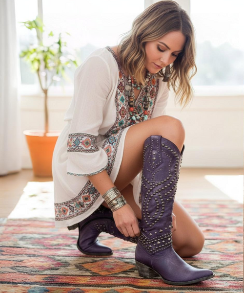 The Belinda has come in a variety of leathers and colors, but none quite as sophisticated as this new offering.   The entire boot shaft is adorned with varying sized chrome studs in both circular and pyramid shapes.  The stacked Sintino heel will give you extra height and walking in the round pointed toe will be a breeze.