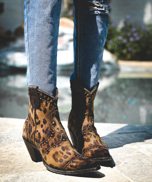 Honor a beautiful and fun tradition in these made for fall Cheetah ankle boots...fashioned with gold rivets and black piping these boots hit the mark!
Kick up your heels with this new style that pairs beautifully with jeans, leggings, tights or your favorite skirt.
Measurements: 

Shaft Height - 5"
Heel - Milano Dama
Toe - Sintino