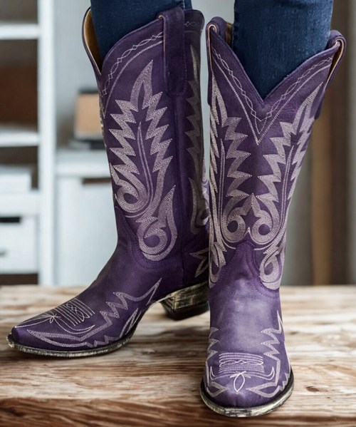 Adding to the ever popular collection of Nevada boots we offer a soon to be favorite in a gorgeous vintage Morado Purple color way which is a Boot Junky exclusive...these boots bond the time-honored art of handmade boots with a contemporary flair for fashion. 

All Old Gringo Boots are unique, comfortable and made with the highest quality leathers. We add art to footwear using embroidery, crystals, stud patterns, inlay/overlay, hand tooling, painting, and laser etching. Every Old Gringo boot is the culmination of an over 250-step production process performed by our skilled craftsmen. 

Height - 15"

Toe - 4L Snip

Heel - 9964 Walking Heel

Handmade
