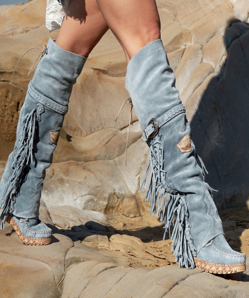 Coleen allows you to explore the world without worrying. 

Its combination of prime quality calf leather and vegetable tanned cowhide guarantees maximum comfort. 

Our vintage treatment, together with hand-stitched raw laces, give this boot a unique touch complemented by indomitable fringes and an elegant side buckle.

Available in this gorgeous spring Sky blue color, Coleen is the perfect travel buddy.
