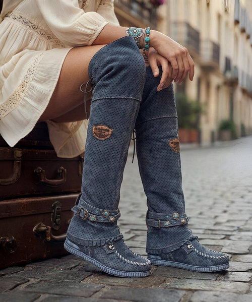 Our Vision moccasin-style boot features a plain over-the-knee bootleg, 2 3/4" hidden wedge, a cool ankle strap and the typical thick handmade stitching on the instep, distinctive feature of El Vaquero brand. Its simplicity gives the Vision boot a timeless elegance. Finished with the renowned Silverstone wash, a milestone of El Vaquero brand, that enhances every shade of leather, showcasing the most intense colors and making each boot unique in its kind.

Hidden wedge 2 3/4"
Vintage Treatment
100% Calf suede
Handmade Stitching
Hand-inserted details
Metal details 100% nickel-free
Rubber sole
Made in Italy