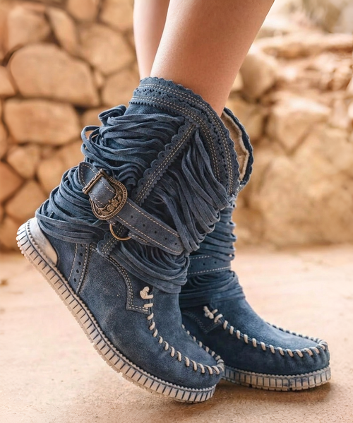 Our Vision moccasin-style boot features a plain over-the-knee bootleg, 2 3/4" hidden wedge, a cool ankle strap and the typical thick handmade stitching on the instep, distinctive feature of El Vaquero brand. Its simplicity gives the Vision boot a timeless elegance. Finished with the renowned Silverstone wash, a milestone of El Vaquero brand, that enhances every shade of leather, showcasing the most intense colors and making each boot unique in its kind.

Hidden wedge 2 3/4"
Vintage Treatment
100% Calf suede
Handmade Stitching
Hand-inserted details
Metal details 100% nickel-free
Rubber sole
Made in Italy