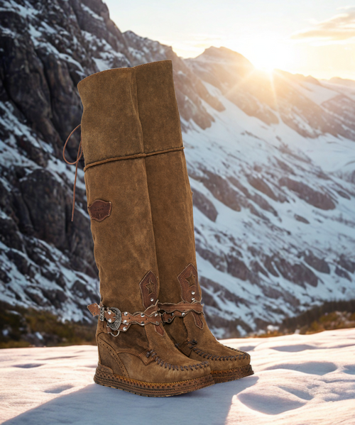 Huntress is a very clean creation in design, decorated only by a symbolic leather strap and completed with our raw hand-stitched laces.

Flexible and soft, it is worked with a stone washed treatment that gives it its timeless look and beautiful natural shades. 

Available in this distinct Silverstone Tobacco, this creation is perfect for every season.

2 3/4" Inner wedge heel
1 1/2" wedge sole
Suede upper
Back half lace-up closure with reinforced eyelets
Adjustable leather straps with buckle closure
Stitching details
Side logo patch detail
Leather insole
Rubber sole
Made in Italy
Composition: 100% Calf