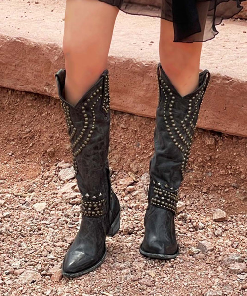 The Old Gringo Belinda Black Boots are a statement in not just the western world, but rock world also! Yes, technically they are cowboy boots, but they are also an awesome pair of fashion boots! The dark distressing on the charcoal black leather gives the boots a funky, vintage look. Fabulous stud work decorates the entire 18 boot shaft.