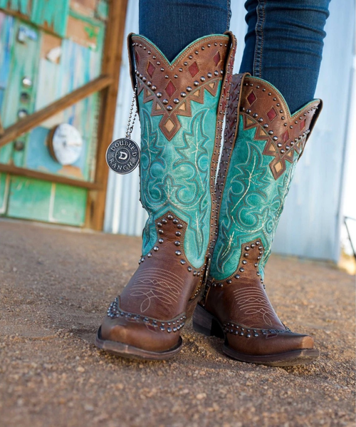 Bold and unapologetic, the Straight as an Arrow western boot makes a striking statement in a rich Oryx turquoise hue. Finished with eye-catching riveted detailing, this standout style blends classic Western craftsmanship with modern edge.

Designed with a sleek 4Long toe and grounded by the dependable 9964 heel, this boot offers both a sharp silhouette and all-day wearability. The 13" shaft height creates a versatile profile that pairs effortlessly with denim, dresses, or layered looks. Confident, distinctive, and right on target—this boot is made for those who like their Western style straight as an arrow.

Details:

Style Name: Straight as an Arrow

Color: Oryx

Toe: 4Long

Heel: 9964