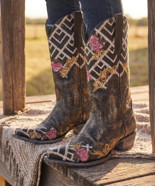 ### Old Gringo Keene Beige – YL469-1

**A little vintage romance, a little western attitude, and a whole lot of Old Gringo artistry.** ?✨

Meet **Keene by Old Gringo**, a collector-worthy design originally introduced in Old Gringo’s Fall 2021 collection. Crafted from beautifully distressed cowhide leather, Keene pairs an earthy, timeworn finish with an unexpected mix of intricate embroidery and bold geometric detailing for a look that feels as special today as when she was first introduced.

The shaft immediately steals the show with its striking **black and beige geometric embroidery**, creating an almost textile-inspired effect against the leather. Feminine embroidered roses in shades of pink and red soften the design, while scrolling golden embroidery winds its way across the shaft, vamp and dramatically pointed toe. The contrast is gorgeous—**rugged, romantic and unmistakably Old Gringo.**

And then there is that silhouette. The elongated **4Long toe** gives Keene an elegant, slightly dramatic profile, while Old Gringo's **9964 heel** and 12-inch shaft keep her rooted in classic western style. Every bit of distressing, embroidery and variation in the leather contributes to the character of the boot—no two pairs will look exactly alike.

This is the kind of Old Gringo boot we love at Boot Junky: **wearable art with a story to tell.** Pair Keene with denim and a simple tee and let the boots do all the talking, or wear her with dresses, skirts and layers for an eclectic bohemian-western look.

For the Old Gringo collector who loves finding those unforgettable designs from years past, **Keene is one worth adding to the collection.** ??

**Details:**

* **Style:** Keene
* **Model:** YL469-1
* **Color:** Beige
* **Leather:** Cowhide
* **Shaft Height:** 12"
* **Toe:** 4Long
* **Heel:** 9964
* **Handcrafted by Old Gringo**

**Old Gringo boots aren't simply made—they're brought to life by skilled artisans through hundreds of individual steps. Keene beautifully captures that tradition with richly distressed leather, elaborate embroidery and the wonderfully unexpected details that have made Old Gringo boots collectible works of wearable art.**
