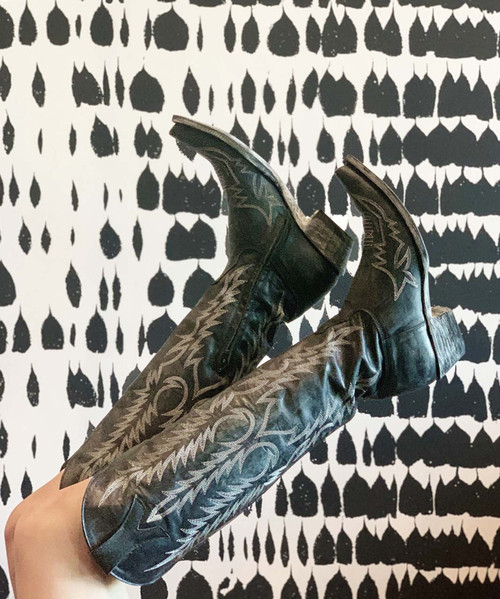 The Old Gringo Mayra Boots are SO on trend. These aren't just cowgirl boots; these are fabulous fashion boots. Handcrafted in Leon, Mexico with gorgeous distressed black Vesuvio leather and accented with silver embroidery. We love the tall, 18" silhouette and snip toe of the Mayra Boots.